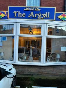 a store front with a sign that reads the arisel at Argyll guest house in Blackpool
