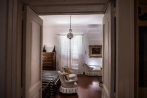 a living room with two chairs and a couch at Beatrice Apartment Sea View in Vietri