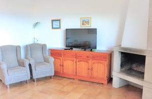 TV a/nebo společenská místnost v ubytování Apartamento vista al mar 313 - 2H