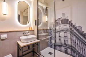 a bathroom with a sink and a shower at Campanile PRIME - Suresnes - La Défense in Suresnes +83 photos