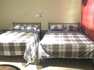 Ein Bett oder Betten in einem Zimmer der Unterkunft Villa at Grace