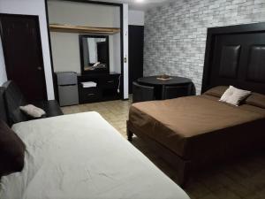 Кровать или кровати в номере Casa Sol, Residencia para Grupos, 25 personas