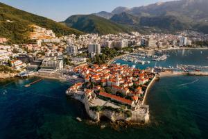 an aerial view of a town on the water at Alessandra Apartments & free private parking in Sveti Stefan