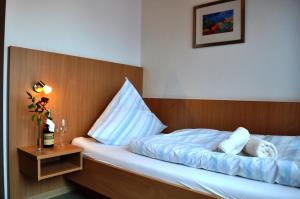 Postel nebo postele na pokoji v ubytování Hotel Meyerhoff