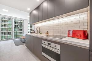 a kitchen with a red appliance on a counter at Downtown Luxury Studio Pool and Gym in Miami