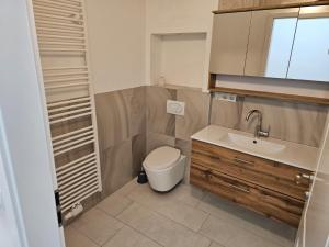 a small bathroom with a toilet and a sink at GardenLoft no2 in Vienna