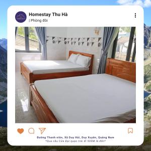 een foto van twee bedden in een kamer bij Homestay Thu Hà in Duy Xuyên