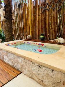 a small swimming pool in a stone tub at Casa Quetzal Hotel in Valladolid