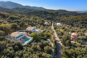 an aerial view of a house with a swimming pool at Villa Panorama Andrea by Villa Plus in Ágios Ilías