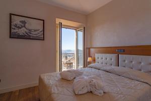 Postel nebo postele na pokoji v ubytování Hotel Rosa + 37 fotografií