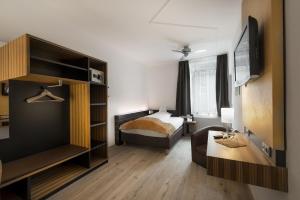 
Ein Bett oder Betten in einem Zimmer der Unterkunft Leipziger Hof Innsbruck
