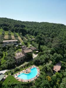 an aerial view of a resort with a swimming pool at Luce in Magione