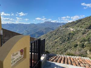 a building with a view of a mountain at Casa zia Vincenzina in Casalvecchio Siculo