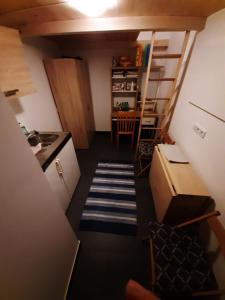 a small room with a kitchen and a table at Monte Vacation Apartments Vienna 10 Minutes to downtown in Vienna