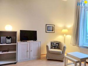 TV a/nebo společenská místnost v ubytování Residenz am Rosengarten - Wohnung 23