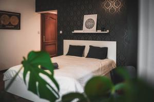 Posteľ alebo postele v izbe v ubytovaní KANIA Apartamenty - Zakopane