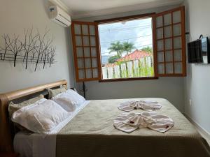 Postel nebo postele na pokoji v ubytování Pousada Maria Monteiro Tiradentes