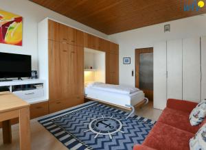 TV a/nebo společenská místnost v ubytování Villa Alexandra - Ferienwohnung 25