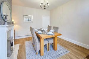 a dining room with a wooden table and chairs at Host & Stay - Appleton House in Newark-on-Trent