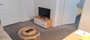 TV a/nebo společenská místnost v ubytování Ferienhaus Pauls Ferienhaus Pauls, Whg 06