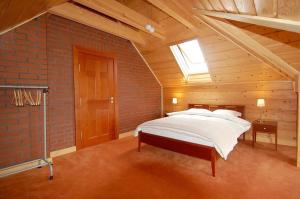Katil atau katil-katil dalam bilik di Haus am Meer