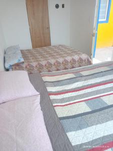 a bedroom with two beds in a room at hermoso departamento un lugar para descansar 2 in Tlaxcala de Xicohténcatl