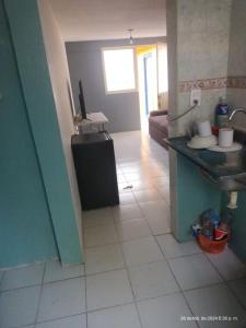 a kitchen with a sink and a tiled floor at hermoso departamento un lugar para descansar 2 in Tlaxcala de Xicohténcatl