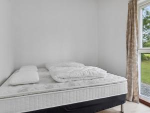 Llit o llits en una habitació de Holiday Home Odsten - all inclusive - 800m from the sea by Interhome