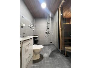 a bathroom with a toilet and a shower at Holiday Home Rakkaranta b- lentäjän poika 2 by Interhome in Hyrynsalmi