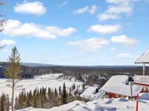 a winter view from the balcony of a lodge at Holiday Home Aurinkoalppi 12b paritalo by Interhome in Hyrynsalmi