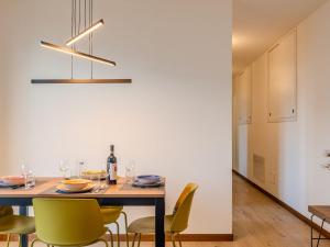 a dining room with a table and chairs at Holiday Home La Terrazza sul Lago by Interhome in Bellano +32 photos