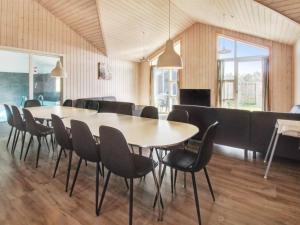 a conference room with a table and chairs at Holiday Home Eilen - all inclusive - 3-3km from the sea by Interhome in Rømø Kirkeby