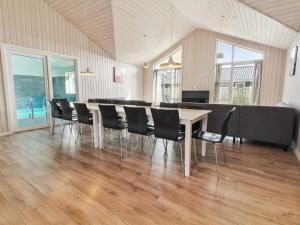 a dining room with a table and chairs at Holiday Home Blaga - all inclusive - 3-3km from the sea by Interhome in Rømø Kirkeby