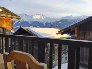 a balcony with a view of a snow covered mountain at Apartment Les Moulins by Interhome in Verbier