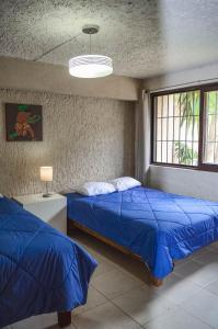 Postel nebo postele na pokoji v ubytování Naranjo Hostel + 37 fotografií