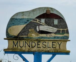 a sign with a boat on top at Chalet 69 in Mundesley