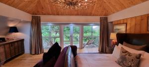 a living room with a couch and a chandelier at Big Sky Ranch in Colesberg