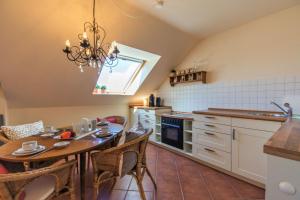 Kuchyň nebo kuchyňský kout v ubytování Ferienwohnung Ihr Zuhause am Meer