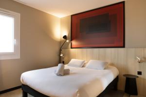 Postel nebo postele na pokoji v ubytování ibis Douai Dechy