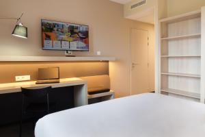 Postel nebo postele na pokoji v ubytování ibis Douai Dechy