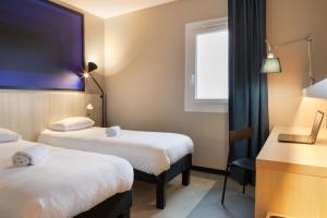 Postel nebo postele na pokoji v ubytování ibis Douai Dechy