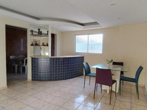 a dining room with a table and chairs at APtº 1º andar em Olinda Casa Caiada a 100 mts da praia in Olinda