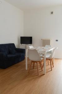 a living room with a table and a couch at Casa vacanze Omero in San Salvo