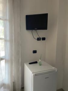 TV a/nebo společenská místnost v ubytování Casa Vacanza Le Case
