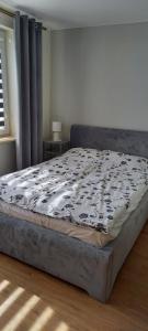 Postel nebo postele na pokoji v ubytování Mieszkanko w centrum