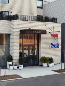 a building with a sign on the front of it at Penny Williamsburg in Brooklyn