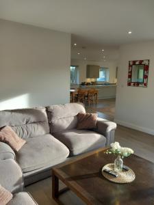 a living room with a couch and a coffee table at The Bungalow, Forest of Dean in Coleford