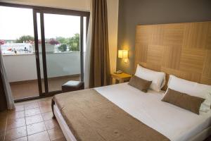 Krevet ili kreveti u jedinici u okviru objekta Zeta Resort Donnalucata