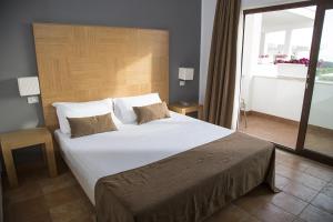 Krevet ili kreveti u jedinici u okviru objekta Zeta Resort Donnalucata
