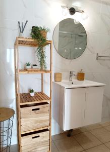 a bathroom with a sink and a mirror at Downtown & Beach in Albufeira